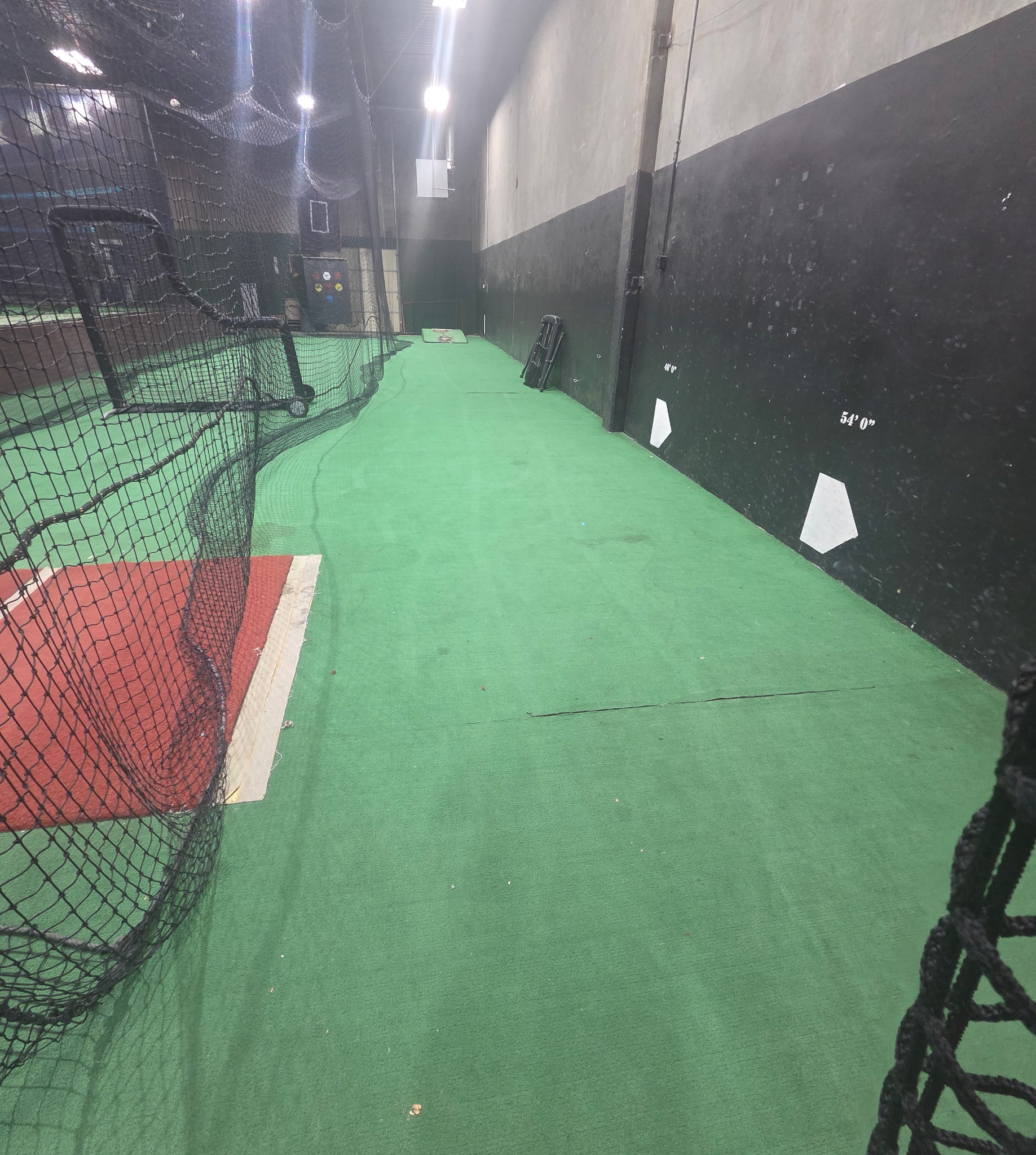 Green turf and pitching distance markings in the long tunnel